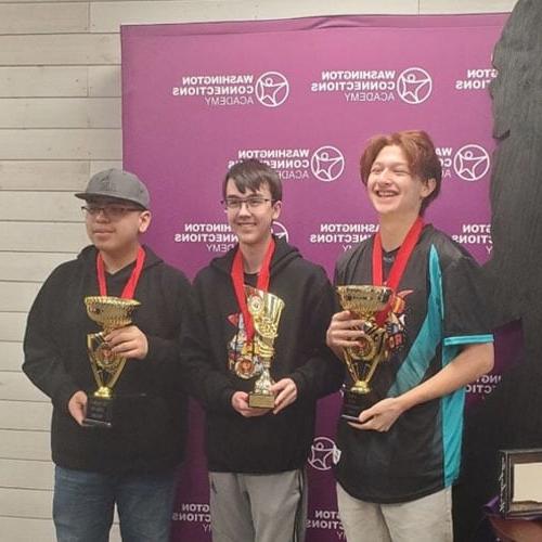 Max K, Victor A, and Oscar S with their championship trophy for esports at Washington Connections Academy. 