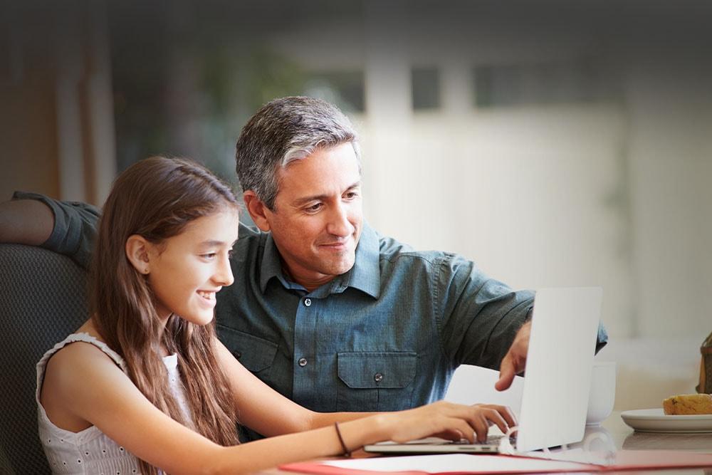 Young girl in in a white shirt with her learing partner taking a Florida Connections Academy class. 